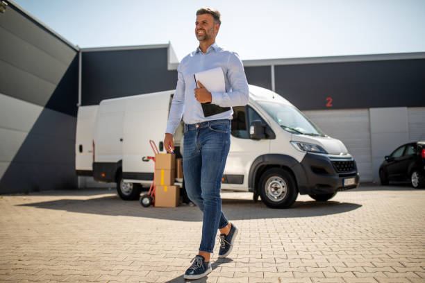 istock Portrait of manager at work in front of a van 1698678577