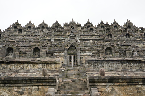 Borobudur is a Mahayana Buddhist temple in Magelang Regency. It is the world's largest Buddhist temple. The temple consists of nine stacked platforms, six square and three circular, central dome.