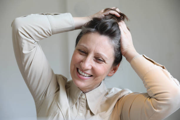 istock Smiling business woman working in office 1698683059