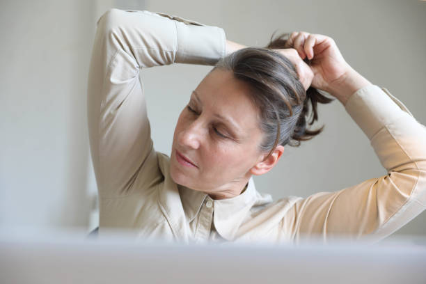 istock Smiling business woman working in office 1698683064