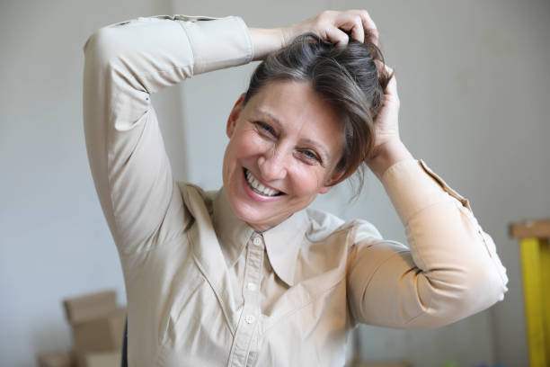 istock Smiling business woman working in office 1698683065