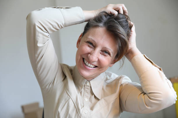 istock Smiling business woman working in office 1698683066