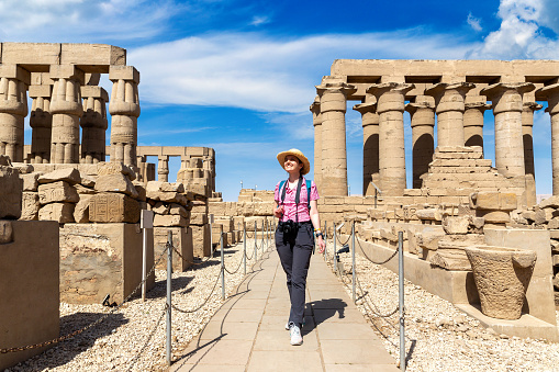 Woman tourist at Luxor Temple in a sunny day, Luxor, Egypt