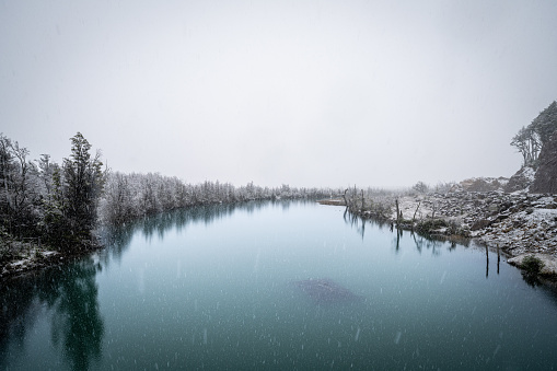 Ibanez river flowing through snowy forests in the chilean Patagonia