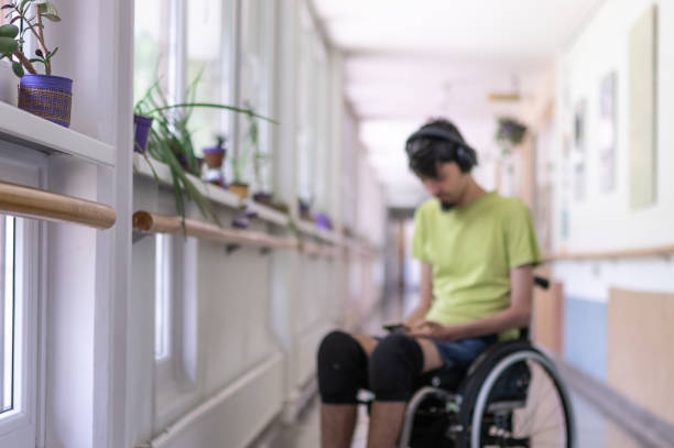 istock Disabled teenager with digital devices. 1698707776