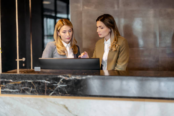 istock Hotel Manager Talking to Female Receptionists 1698740092