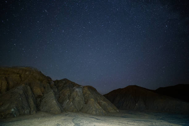 istock night sedimental mountains at starry night 1698742847