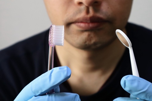 Close-up of a person with dental care products