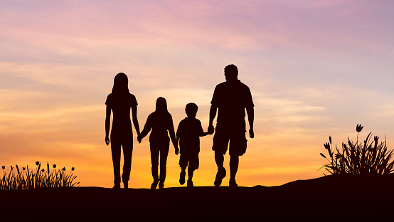 Silhouette of family on the outdoor at sunset