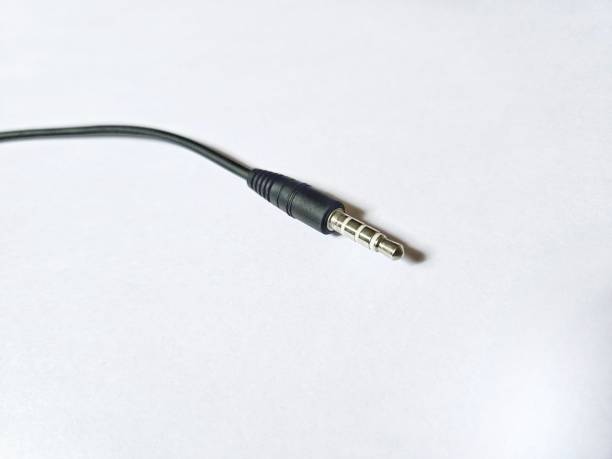 разъем для наушников изолирован на белом фоне. - power supply speaker network connection plug metal стоковые фото и изображения