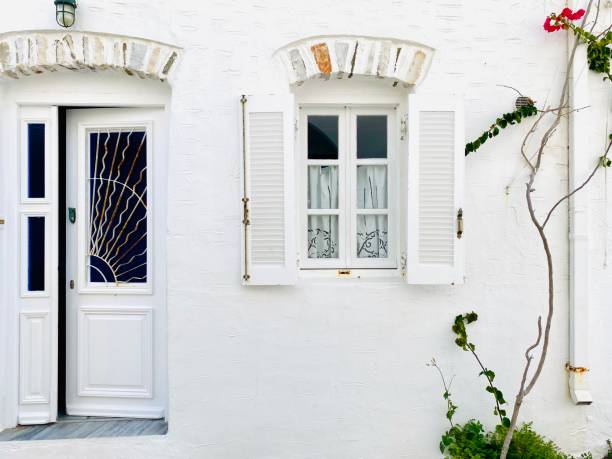 Charming white house front on the island of Paros in Greece, Europe stock photo