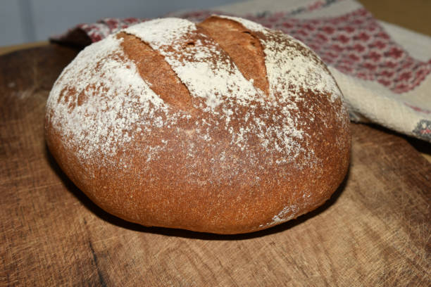 istock Round shaped loaf of bread made from rye flour. 1698773559