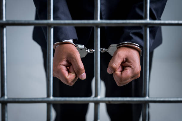 Being arrested for breaking the law, Businessman being handcuffed, demanding bribes for business benefits, offenses in public and private organizations must be prosecuted by law Being arrested for breaking the law, Businessman being handcuffed, demanding bribes for business benefits, offenses in public and private organizations must be prosecuted by law. prisoner stock pictures, royalty-free photos & images