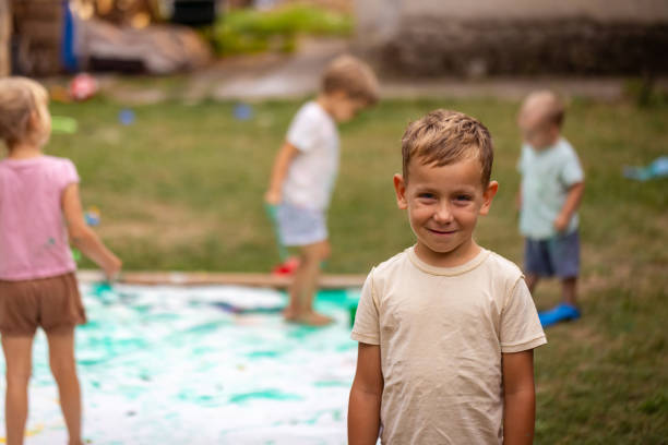 istock Child drawing outdoors 1698787320