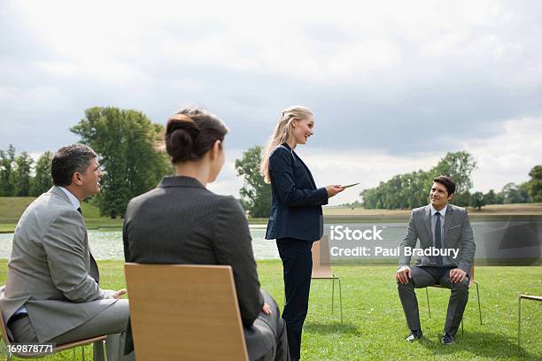 Business People Having Meeting Outdoors Stock Photo - Download Image Now - 20-24 Years, 25-29 Years, Adult