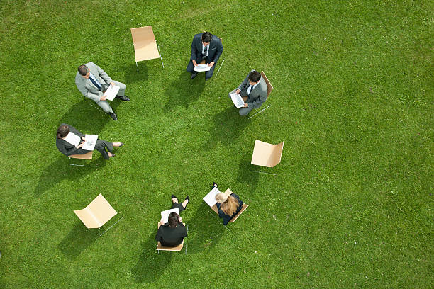 Business people having meeting outdoors  team harmony stock pictures, royalty-free photos & images