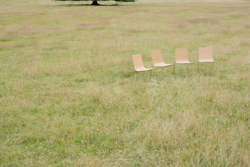 camping chair on a green meadow on a sunny day