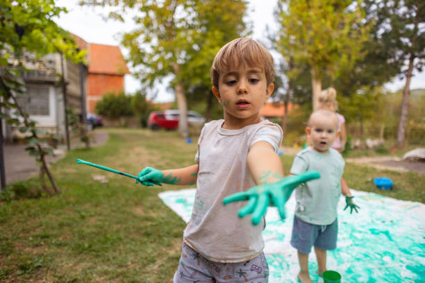 One happy child with a great idea decided to put on some flippers and paint