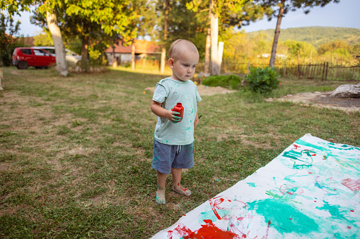 Painting with my children in the backyard