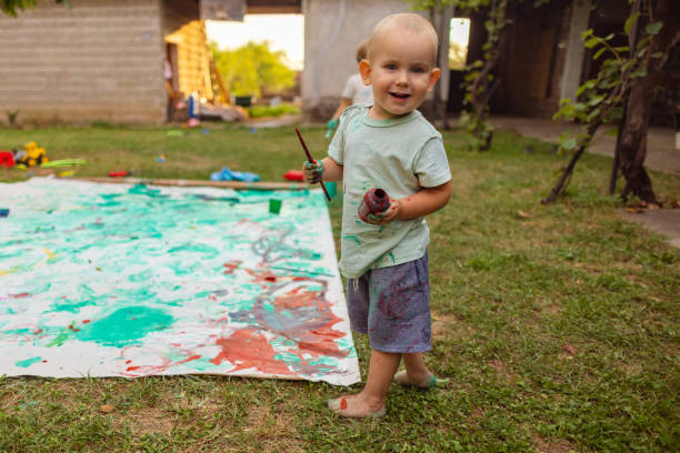 istock Child drawing outdoors 1698797486