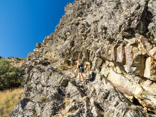 istock Sporty woman on extreme terrain 1698800317