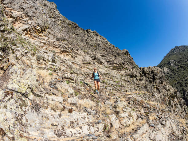 istock Sporty woman on extreme terrain 1698800319