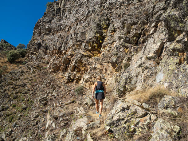 istock Sporty woman on extreme terrain 1698800344