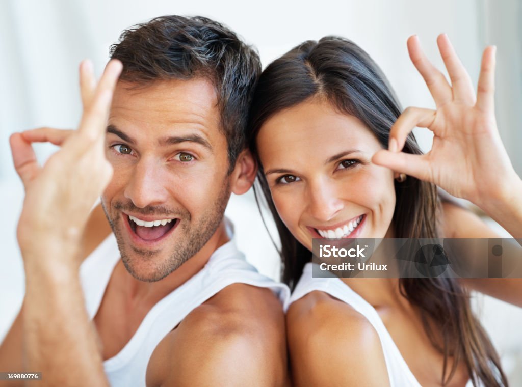 Couple giving ok gesture  Adult Stock Photo