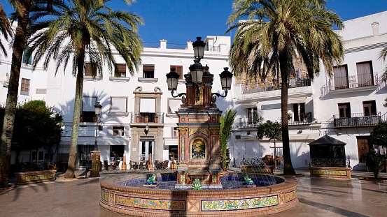 The famous fountain is decorated with bricks and painted tiles (azulejos)