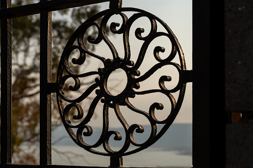 Circular design of a wrought iron fence at the Church of the Beatitudes in Israel.