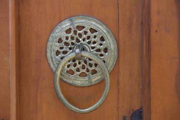 istock carved metal handle on a wooden door 1698877209