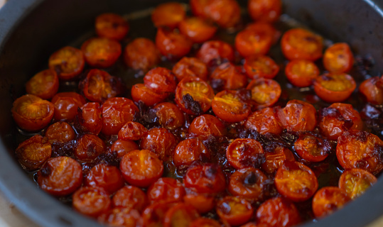 Home grown cherry tomatoes roasyed with Harissa paste
