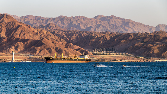 Eilat, Israel September 26, 2022 The view of boats on the red Sea with the Jordanian mountains from Eilat Israel.