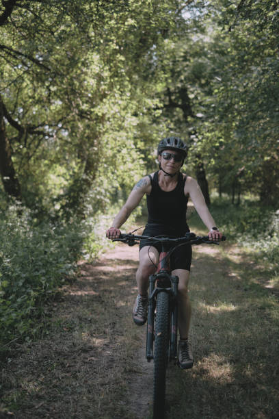 istock A woman riding a bike 1698968684