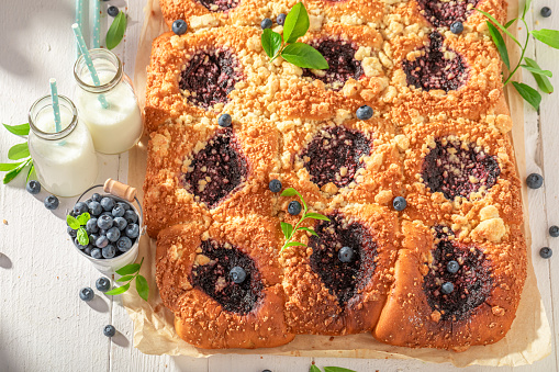 Tasty blueberry yeast cake as sweet summer snack. Cake with blueberries and crumble.