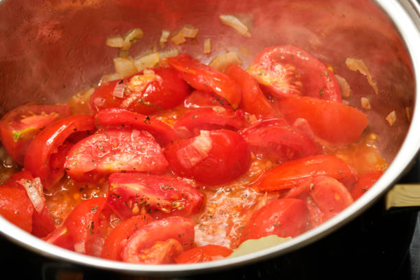 istock Tomatoes and onion in cooking pot 1698976568