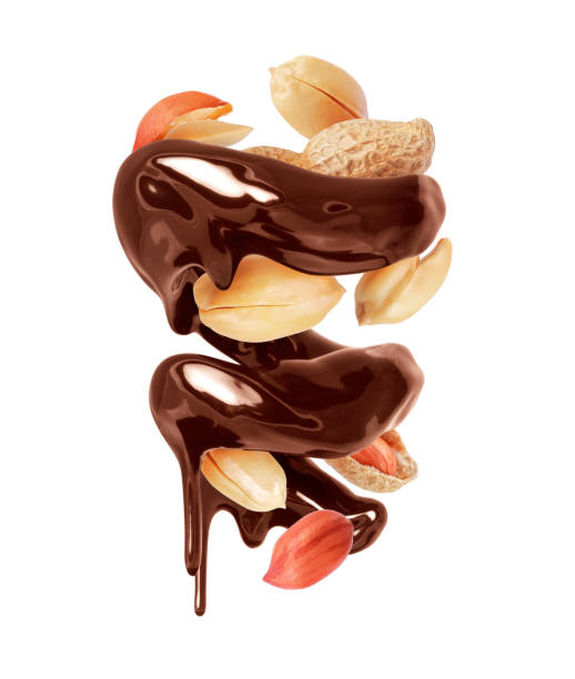 istock Glossy brown spiral made of melted chocolate with peanuts isolated on white background 1698977763