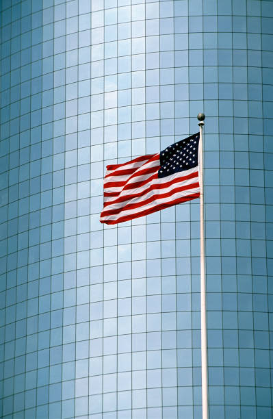 istock American flag in front of an office building 1698996561