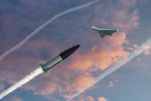 istock Anti-air missile shoots down drone in evening sky, missile launch trail, 3d rendering. Concept: war in Ukraine, Russian drone attack, anti-aircraft defense by military complexes. 1699013882