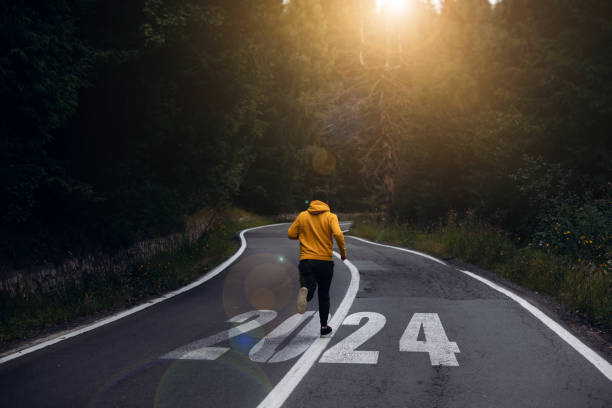 New Year 2024 with new ambitions, challenge, plans, goals and visions.Man running on the mountain road towards new goals in 2024 New Year 2024 with new ambitions, challenge, plans, goals and visions.Man running on the mountain road towards new goals in 2024. 2024 30 stock pictures, royalty-free photos & images