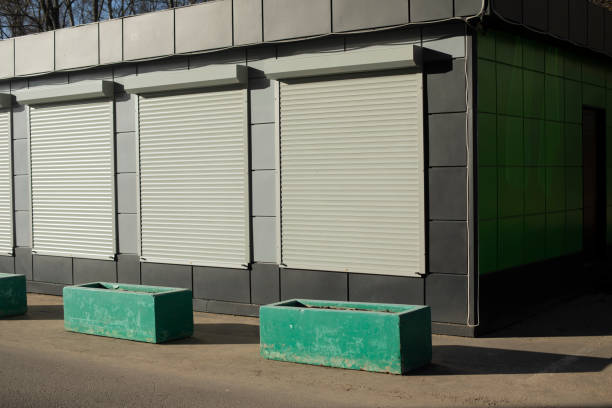 istock Office building with shutters on windows. Small Shop. 1699035189