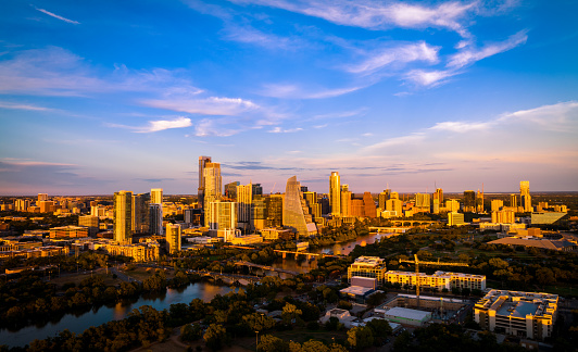 aerial drone views above the Capital city of Texas with Bright Beautiful Colors over Austin Texas USA Cityscape at Golden Hour Sunset