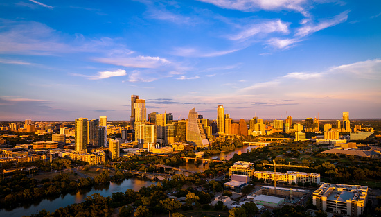 Austin, Texas, USA - September 15, 2023: Perfect Golden Hour Colors over Cityscape Views of Austin Texas Downtown near Town Lake with Traffic and congested Capital city views