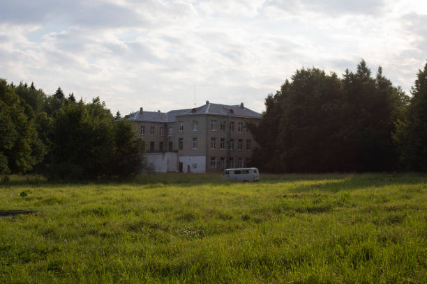 istock Car drives through field. Green park. 1699038026