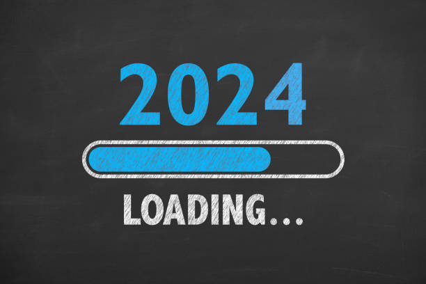 loading new year 2024 on blackboard background - determination new years eve list aspirations imagens e fotografias de stock