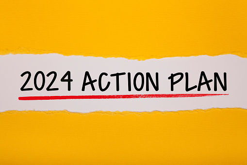 Torn Paper With New Year 2024 Action Plan On White Background