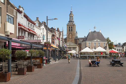 Roosendaal, Netherlands, September 15, 2023; Cozy square with terraces overlooking the St. John's Church in Roosendaal.