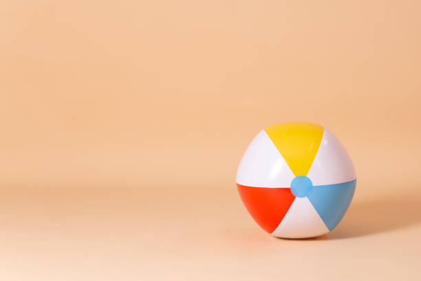 istock colorful beach ball on color background 1699094173