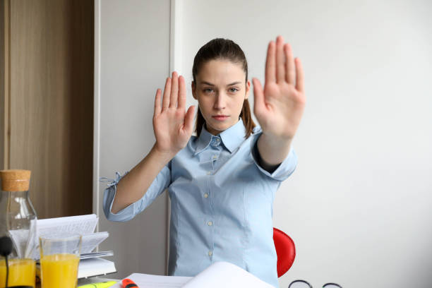 istock business woman showing palms 1699096669