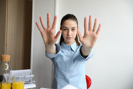 young business woman with outstretched arms and fingers